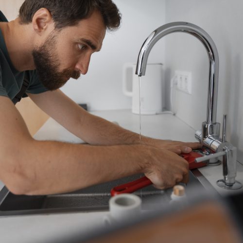 side-view-man-working-as-plumber